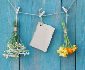 Two bouquets of camomile and calendula and sheet of paper for me