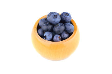 Wooden cup with blueberries