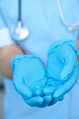 woman doctor in medical gloves