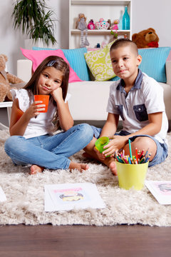 Twin borther and sister spend time at home