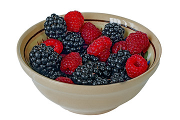raspberries blackberries in bowl on white background