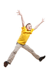 Funny little child in yellow t-shirt jumping in excitement