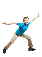 Funny excited child in t-shirt jumping / dancing