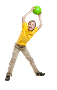 Funny child in yellow t-shirt jumping and laughing