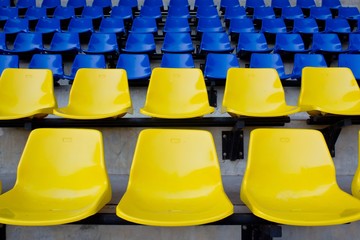 Naklejka premium Blue, Yellow seat rows in stedium
