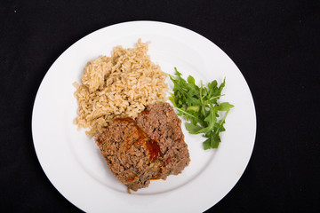 Meatloaf Rice and Arugula on Black