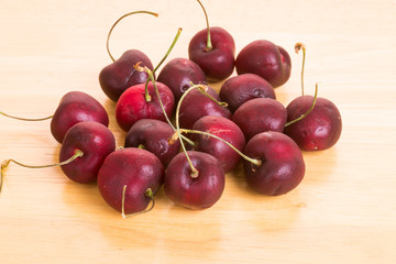 Red Cherries on a Wood Table