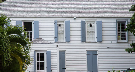 Wood Siding Building with Grey Shutters