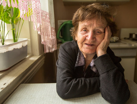 Smiling senior woman in the kitchen.