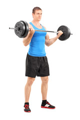 Muscular bodybuilder lifting a barbell