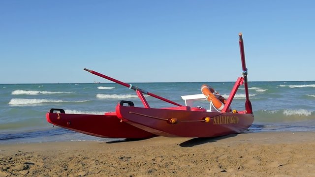 typical red rescue boat, Rimini, Italy, slow motion