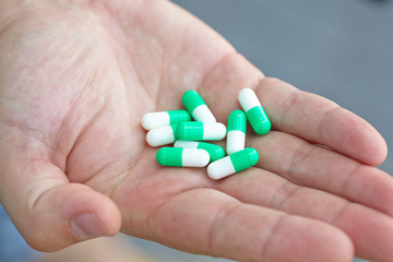 the doctor gave the patient medication capsules