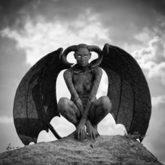 Mystic creature - woman in body paint with wings and horns