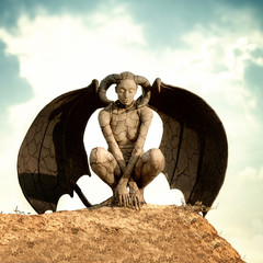 Mystic creature - woman in body paint with wings and horns