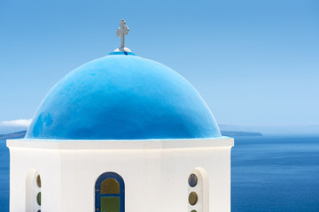 Fototapeta na wymiar Church With Blue Cupola in Santorini, Greece