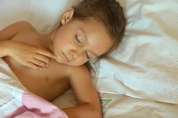 Cute girl sleeping in bed