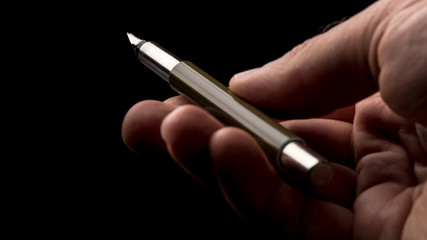 Man holding a fountain pen