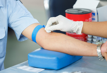Nurse collecting a blood from a patient