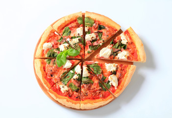 Pizza with cheese, bacon and spinach