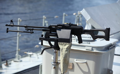 machine gun on the side of a Navy warship © mrivserg