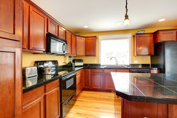 Kitchen room with black granite tops