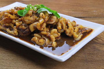 squid. Chinese stir-fried squid with black pepper , garlic and s