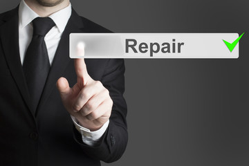 businessman pushing button repair service