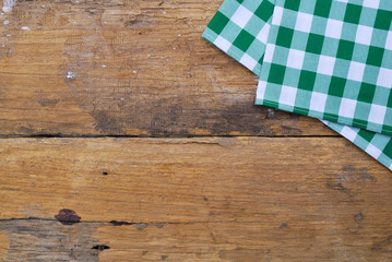 The background made from tablecloth on old wooden table