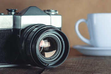 Old Camera And White Cup