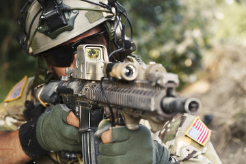 american soldier pointing his rifle