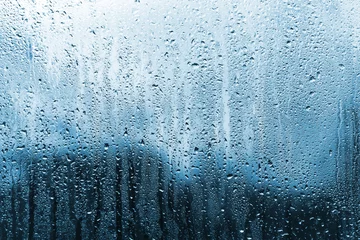Fotobehang regen op glas © Naypong Studio