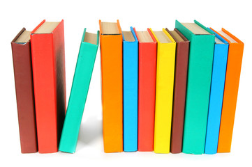 Multi-coloured books. On white background.