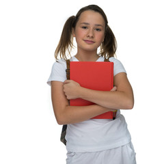 Obraz premium Young schoolgirl clutching a text book