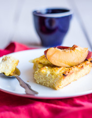 cottage cheese casserole with pasta and peaches, red napkin