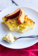 sweet cottage cheese casserole with pasta and peaches, red napki