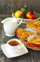 breakfast with homemade peach pie, tea, milk and  fruit
