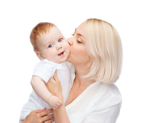 happy mother kissing smiling baby