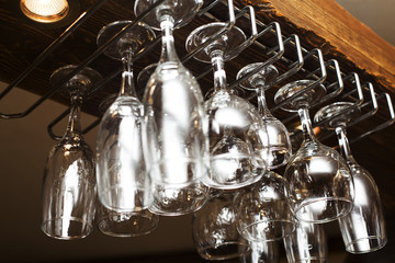 glasses suspended from above the bar