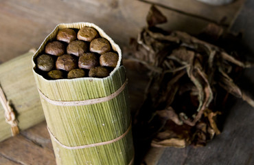 Typical Cubano cigars and leaves