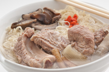Noodle soup with pork and barberry