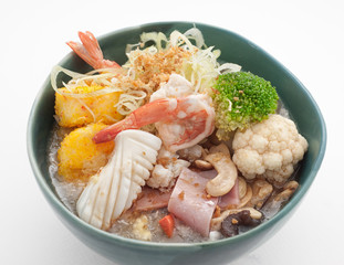 Noodle soup with cabbage, squid, shrimps and broccoli