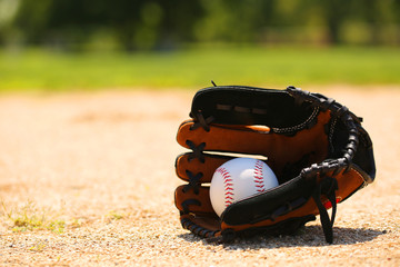 Baseball in Glove on Field