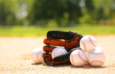 Baseball. Balls and Glove on Field