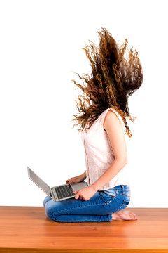 Girl Flipping Hair Holds The Laptop