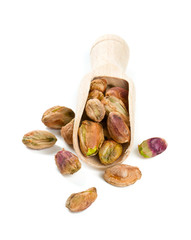 pistachio in scoop isolated on white