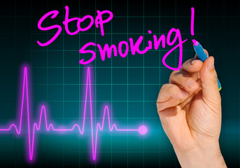Hand writing message STOP SMOKING