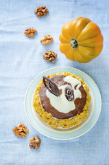 pumpkin cheesecake with chocolate and walnuts