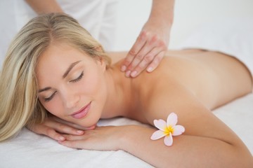 Fototapeta na wymiar Pretty blonde enjoying a massage