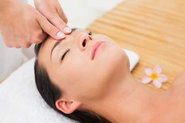 Obraz na płótnie Canvas Smiling brunette enjoying a head massage