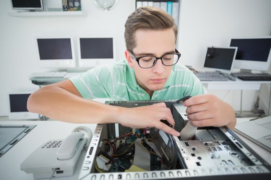 Technician working on broken computer